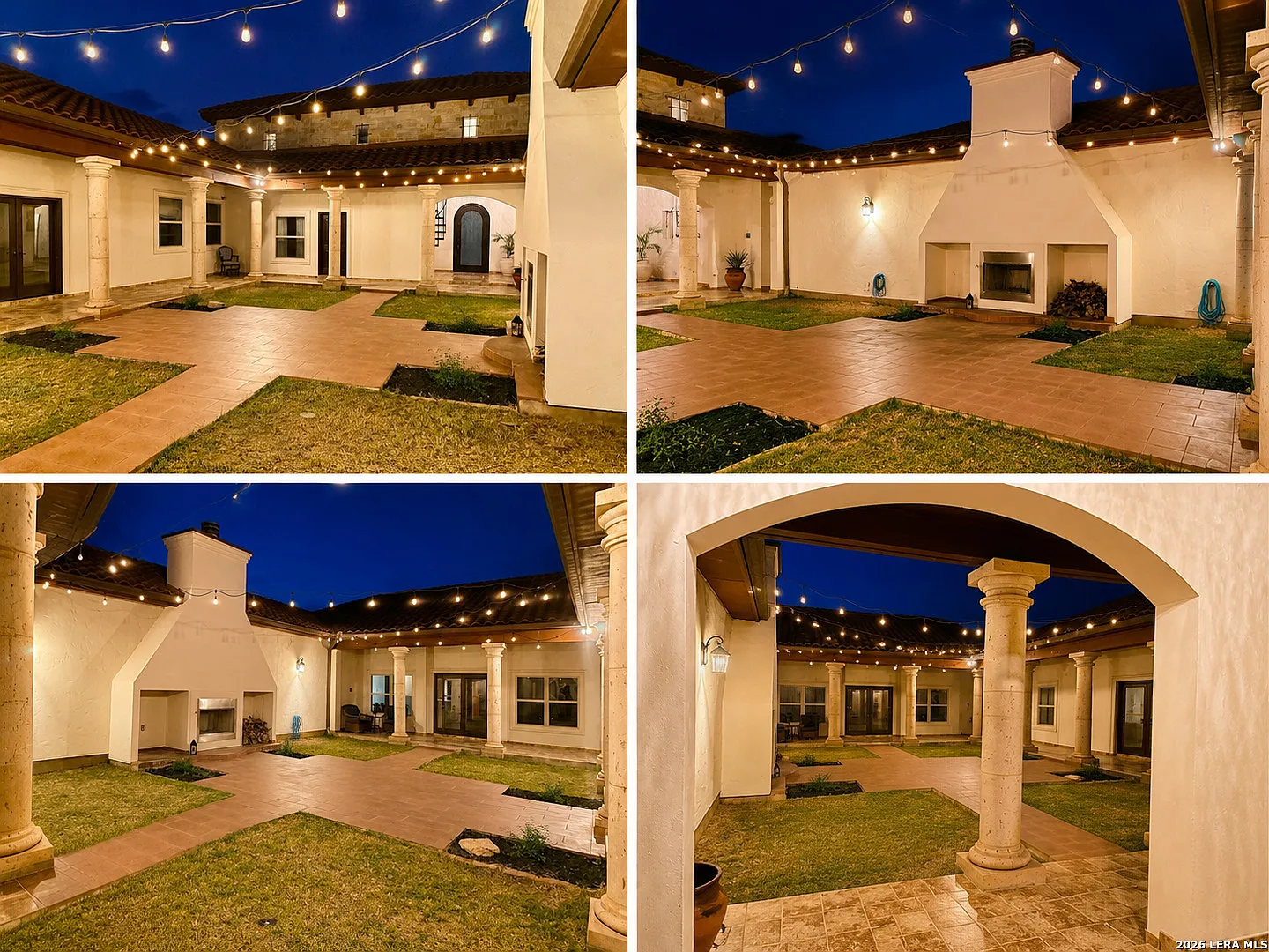 The courtyard at night: stone columns, outdoor fireplace, string lights